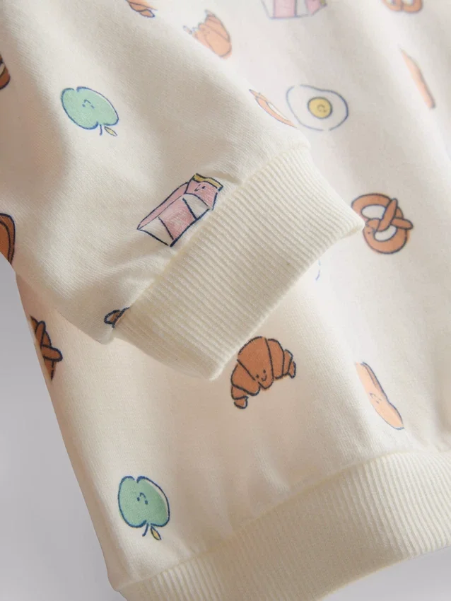 0-18 luni | Set compus din pulover cu imprimeu cu alimente și pantaloni scurți 0-18 luni | Set compus din pulover cu imprimeu cu alimente și pantaloni scurți