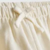 1,5–12 ani | Pantaloni brodați din amestec de in, colecția „The Edit“ 1,5–12 ani | Pantaloni brodați din amestec de in, colecția „The Edit“