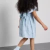 1,5-12 ani | rochie smock brodată cu motive florale „The Edit” 1,5-12 ani | rochie smock brodată cu motive florale „The Edit”