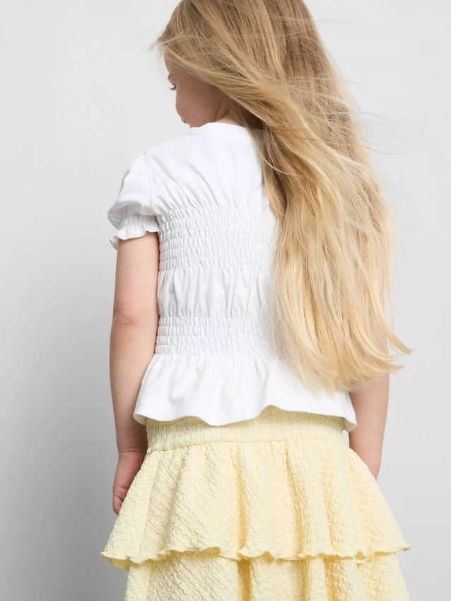 1,5–9 ani | bluză cu peplum plisat 1,5–9 ani | bluză cu peplum plisat