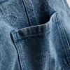 1,5–9 ani | salopetă din denim cu fundiță 1,5–9 ani | salopetă din denim cu fundiță