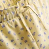 1,5–9 ani | Set compus din tricou cu volane și pantaloni