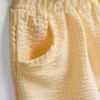 1-9 ani | set compus din bluză cu volane și pantaloni scurți 1-9 ani | set compus din bluză cu volane și pantaloni scurți