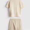 1-9 ani | Set compus din tricou polo texturat și pantaloni scurți 1-9 ani | Set compus din tricou polo texturat și pantaloni scurți