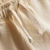 1-9 ani | Set compus din tricou polo texturat și pantaloni scurți 1-9 ani | Set compus din tricou polo texturat și pantaloni scurți