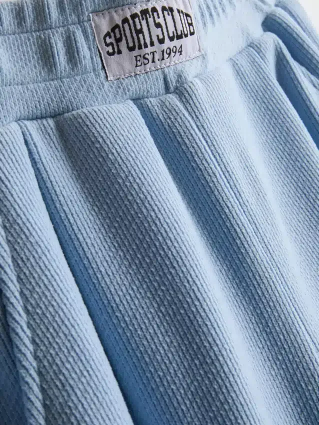 7-15 ani | Pantaloni de Trening cu croi larg și efect periat 7-15 ani | Pantaloni de Trening cu croi larg și efect periat