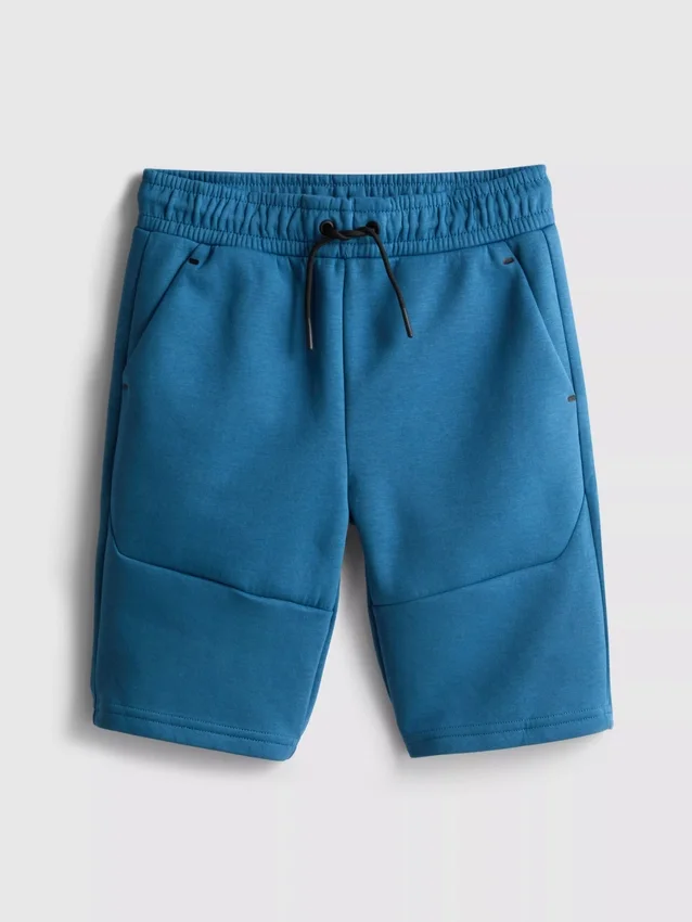 7-15 ani | Pantaloni Scurți cu material laminat 7-15 ani | Pantaloni Scurți cu material laminat