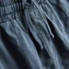 7-15 ani | Set compus din cămășă cu mâneci scurte, texturată, cu nasturi, și pantaloni scurți
