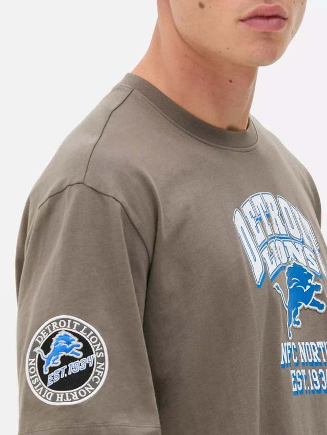 Cămășă cu logo-ul echipei Detroit Lions din NFL Cămășă cu logo-ul echipei Detroit Lions din NFL