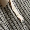 Cămășa polo tricotată în carouri Cămășa polo tricotată în carouri