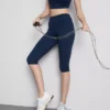 Colanți capri sportivi cu talie înaltă, netede și care oferă susținere Colanți capri sportivi cu talie înaltă, netede și care oferă susținere