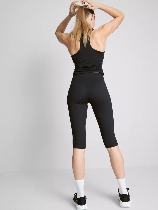 Colanți capri sportivi cu talie înaltă, netede și care oferă susținere Colanți capri sportivi cu talie înaltă, netede și care oferă susținere