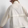 Jachetă de ploaie pliabilă cu fermoar Jachetă de ploaie pliabilă cu fermoar