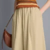 Pantaloni cu croi evazat, plisați, cu aspect de hârtie