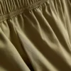Pantaloni cu croi evazat, plisați, cu aspect de hârtie