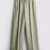 Pantaloni cu croi larg și dungi laterale Pantaloni cu croi larg și dungi laterale