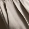 Pantaloni cu croi larg și pliuri