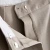 Pantaloni cu croi larg și pliuri