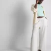 Pantaloni cu talie elastică și croi larg Pantaloni cu talie elastică și croi larg