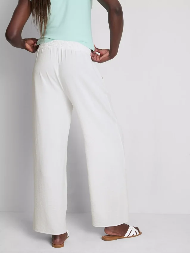 Pantaloni cu talie elastică și croi larg Pantaloni cu talie elastică și croi larg