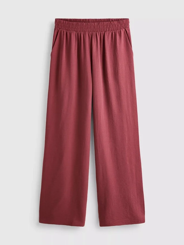 Pantaloni cu talie elastică și croi larg Pantaloni cu talie elastică și croi larg