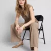 Pantaloni cu talie medie și croi larg Pantaloni cu talie medie și croi larg