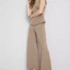 Pantaloni cu talie medie și croi larg Pantaloni cu talie medie și croi larg