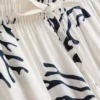 Pantaloni de Pijama cu croi larg și imprimeu coral Pantaloni de Pijama cu croi larg și imprimeu coral