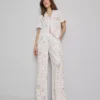 Pantaloni de pijama cu croi larg și imprimeu floral Pantaloni de pijama cu croi larg și imprimeu floral
