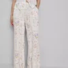 Pantaloni de pijama cu croi larg și imprimeu floral Pantaloni de pijama cu croi larg și imprimeu floral