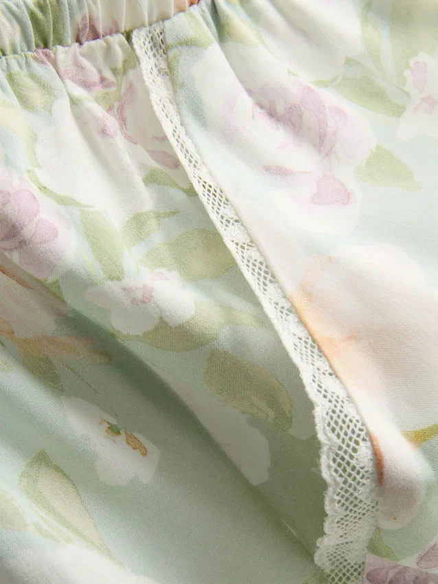Pantaloni de pijama cu croi larg și imprimeu floral Pantaloni de pijama cu croi larg și imprimeu floral