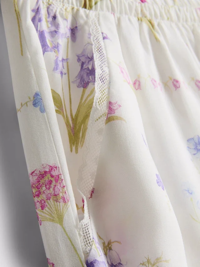 Pantaloni de pijama cu croi larg și imprimeu floral Pantaloni de pijama cu croi larg și imprimeu floral
