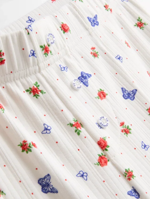 Pantaloni de pijama cu nervuri și imprimeu fluture Pantaloni de pijama cu nervuri și imprimeu fluture