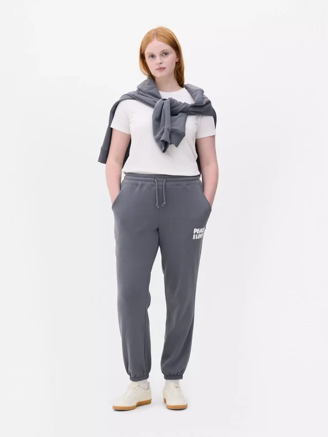 Pantaloni de trening cu manșete și imprimeu Pantaloni de trening cu manșete și imprimeu