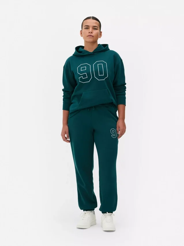 Pantaloni de trening cu manșete și imprimeu Pantaloni de trening cu manșete și imprimeu
