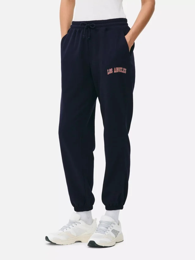 Pantaloni de trening cu manșete și imprimeu Pantaloni de trening cu manșete și imprimeu