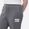 Pantaloni de trening cu manșete și imprimeu Pantaloni de trening cu manșete și imprimeu