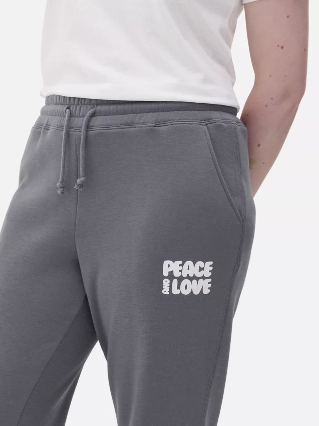 Pantaloni de trening cu manșete și imprimeu Pantaloni de trening cu manșete și imprimeu