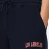 Pantaloni de trening cu manșete și imprimeu Pantaloni de trening cu manșete și imprimeu