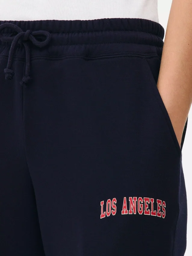 Pantaloni de trening cu manșete și imprimeu Pantaloni de trening cu manșete și imprimeu