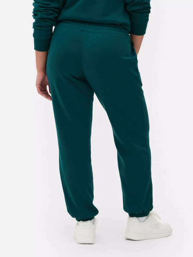 Pantaloni de trening cu manșete și imprimeu Pantaloni de trening cu manșete și imprimeu