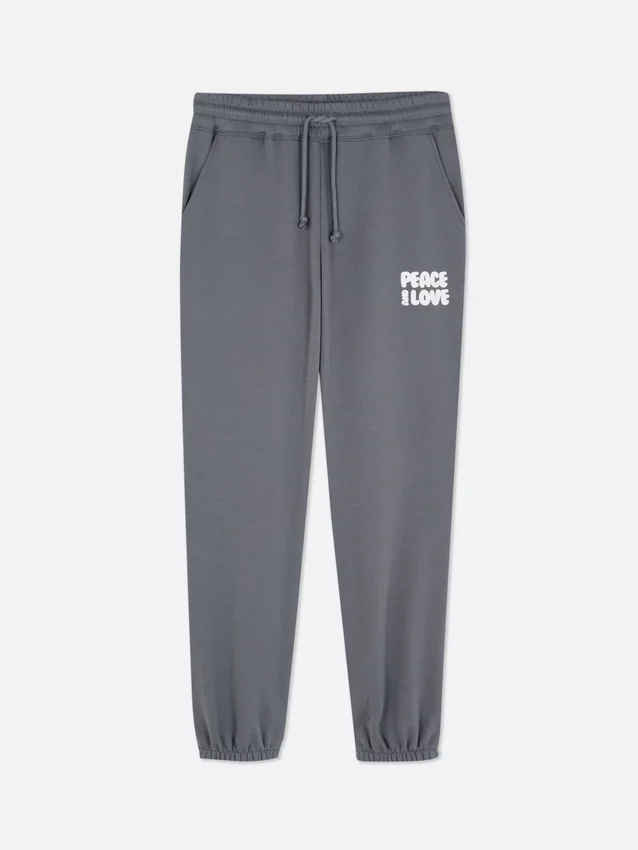 Pantaloni de trening cu manșete și imprimeu Pantaloni de trening cu manșete și imprimeu