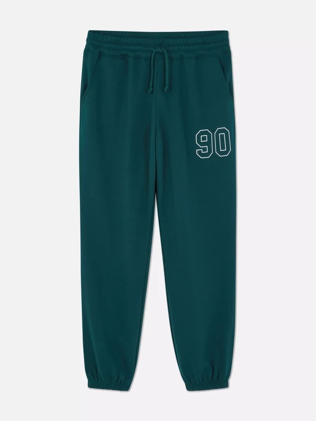 Pantaloni de trening cu manșete și imprimeu Pantaloni de trening cu manșete și imprimeu
