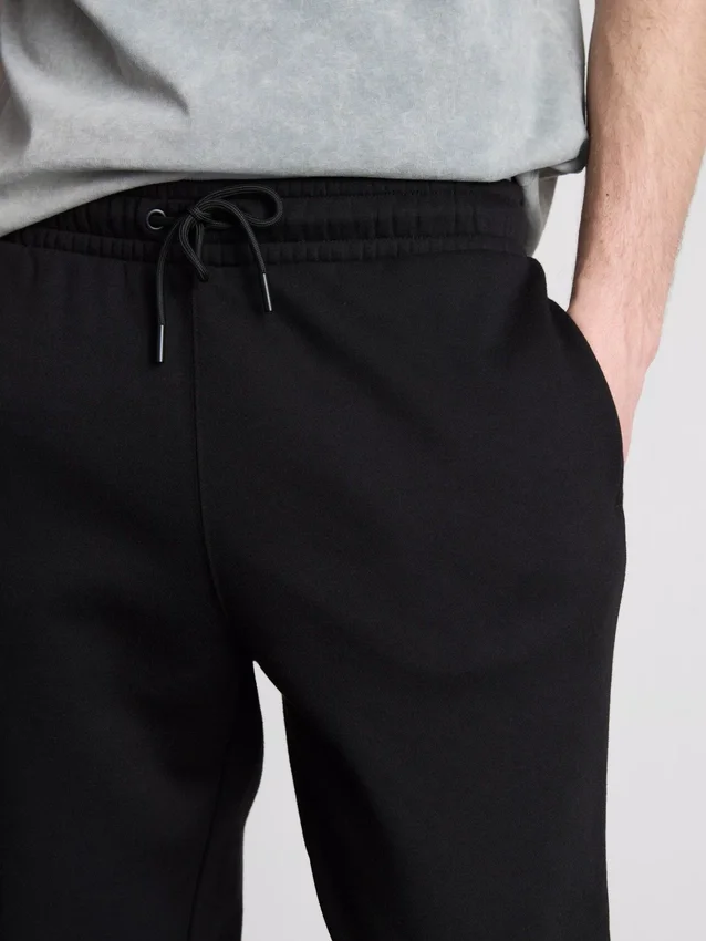 Pantaloni de Trening elastici la talie, cu manșete Pantaloni de Trening elastici la talie, cu manșete