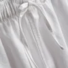 Pantaloni scurți din denim cu volane la tiv Pantaloni scurți din denim cu volane la tiv