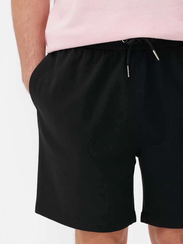 Pantaloni scurți din tricou cu șnur Pantaloni scurți din tricou cu șnur