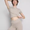 Pantaloni scurți sport fără cusături, cu bandă elastică încrucișată la talie