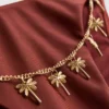 Slip de bikini cu detalii de lanț și legături laterale Slip de bikini cu detalii de lanț și legături laterale