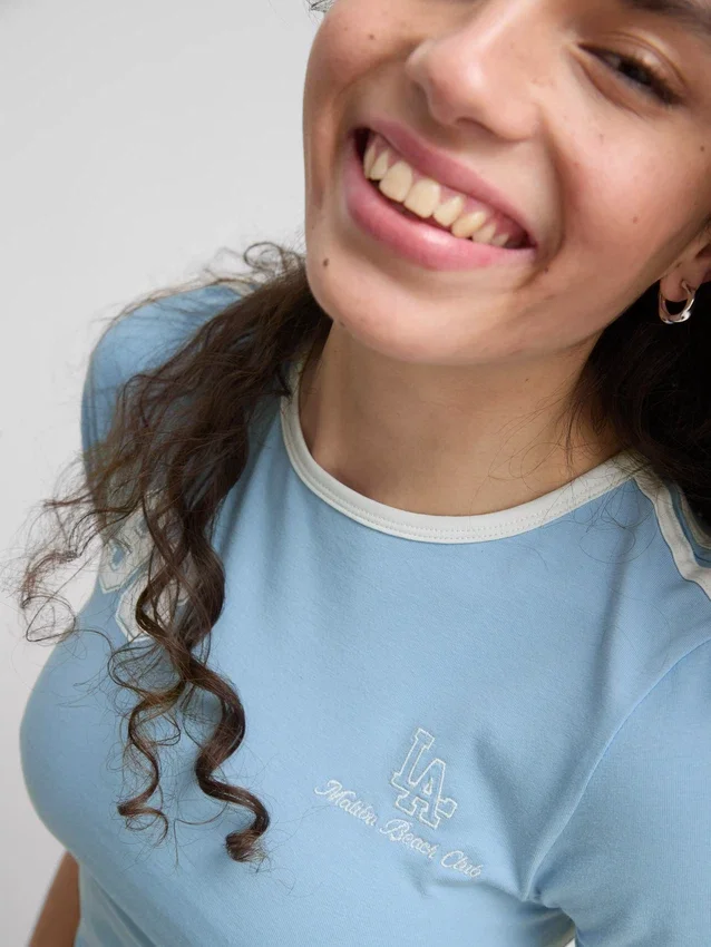 The Primark Scene | Tricou pentru bebeluși din bumbac cu imprimeu grafic The Primark Scene | Tricou pentru bebeluși din bumbac cu imprimeu grafic