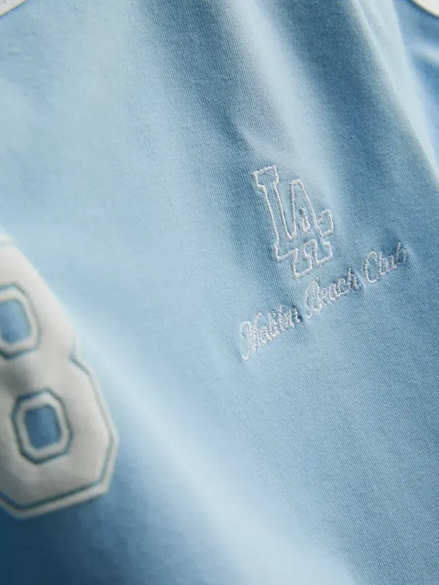 The Primark Scene | Tricou pentru bebeluși din bumbac cu imprimeu grafic The Primark Scene | Tricou pentru bebeluși din bumbac cu imprimeu grafic